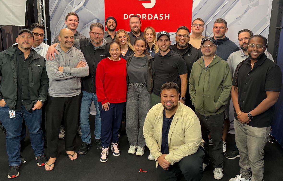 Production team photo in a broadcast studio.