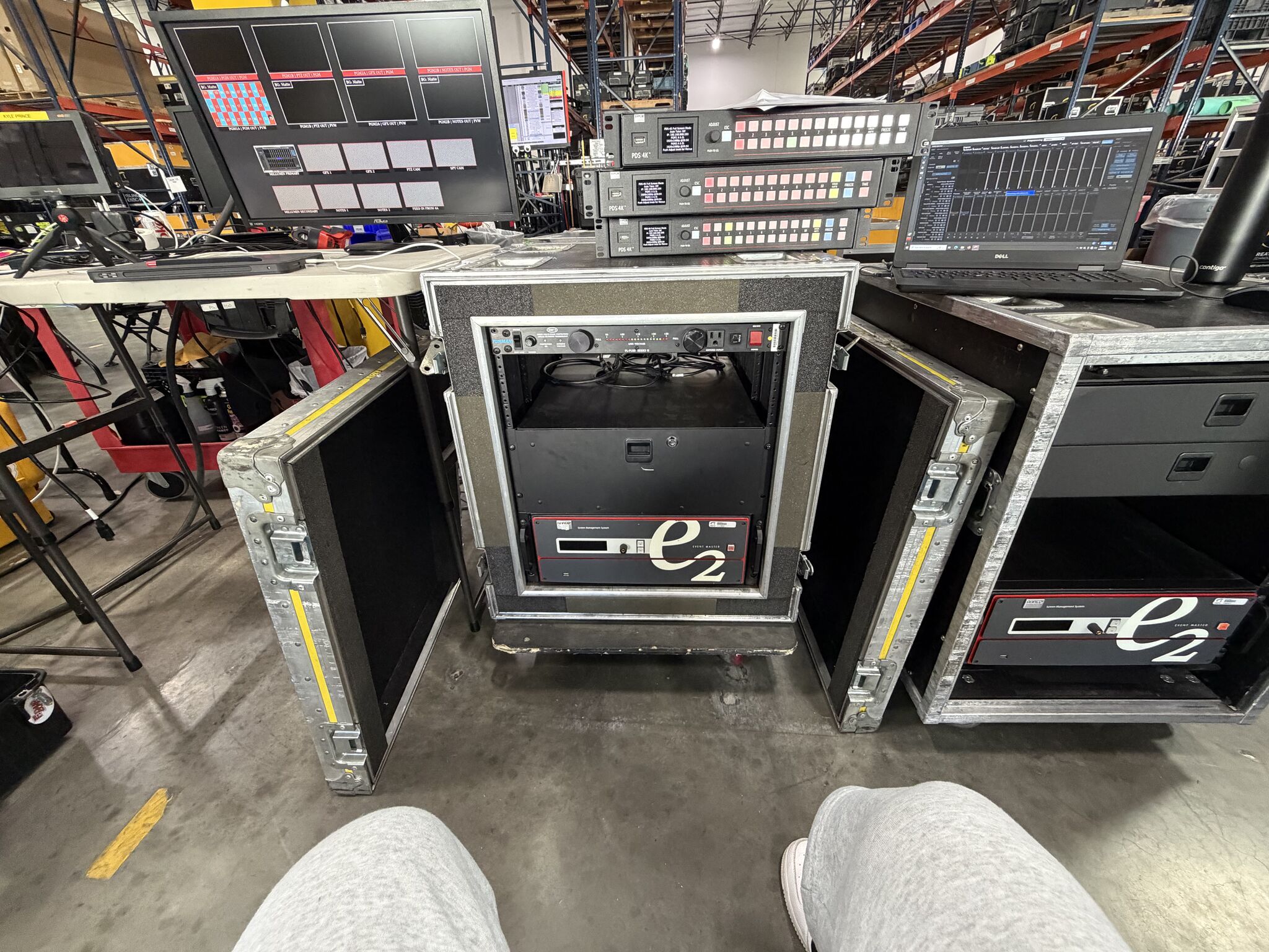 Barco E2 processors, PDS-4K units, and monitoring equipment staged in a prep workspace.
